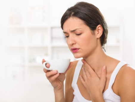 woman with sore throat